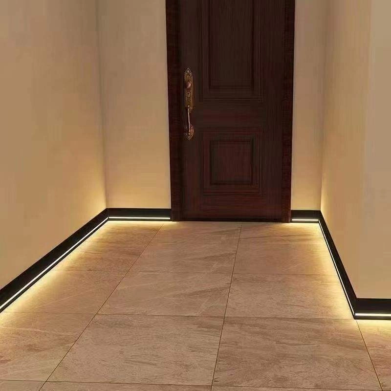 Black aluminum LED skirting board for hallway floor lighting.
