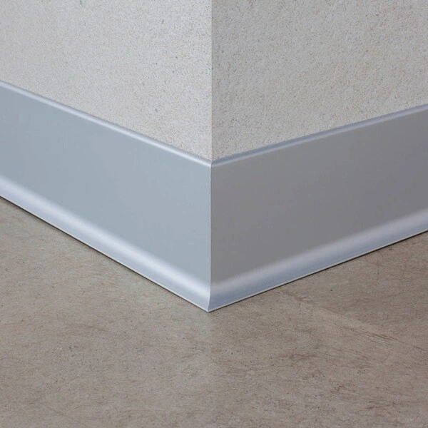 Modern silver aluminum skirting board with a curved base.